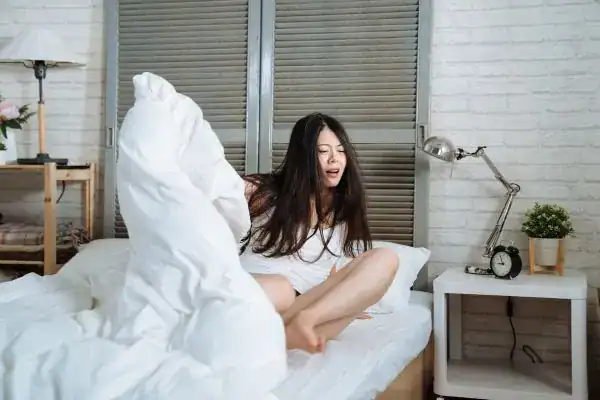 Image of woman getting up because of nighttime leaks Southampton